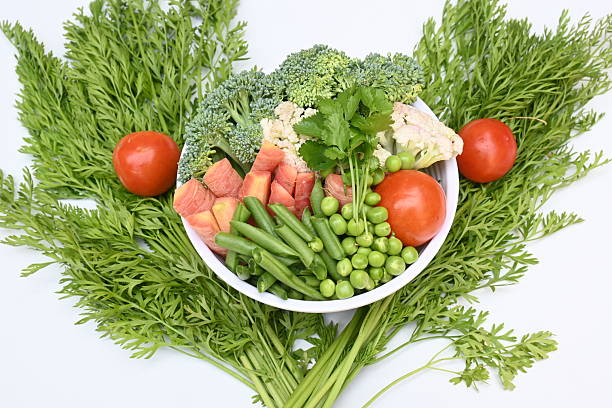 Vibrant medley of fresh vegetables.  Features broccoli, cauliflower, tomatoes, Carrot, green beans, and peas. colourful vegetables of spring time, Its good for health. colorful display.