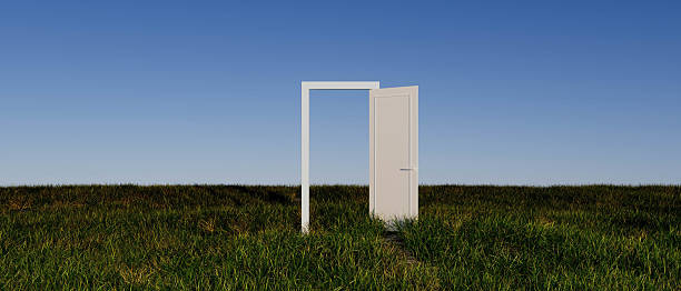 istock A white door is open in a field 2220112219