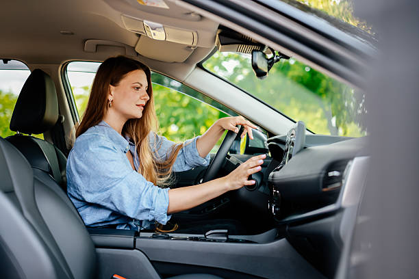 istock A confident young woman driving a car. 2220113348