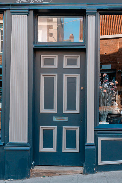 istock Elegant blue door with decorative elements in a quaint town during the daytime, showcasing architectural details and inviting atmosphere 2220118785