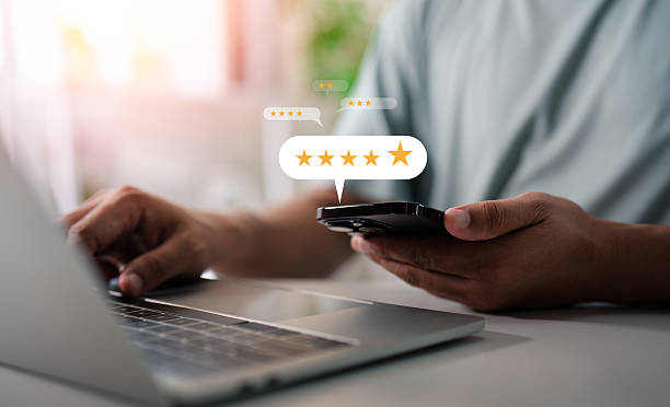 istock User give rating on Mobile phone to service experience on online application, Evaluate quality of service leading to reputation ranking of business. Customer review satisfaction feedback survey concepts. 2220119459
