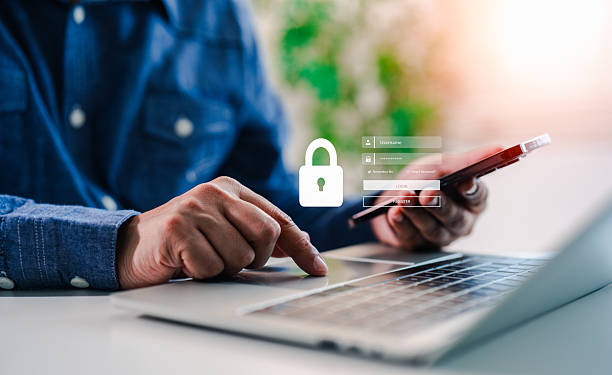 istock Cybersecurity internet network data privacy concepts. Hand of a man using mobile phone and laptop, secure access to user personal information, secure Internet access, information security encryption. 2220119461