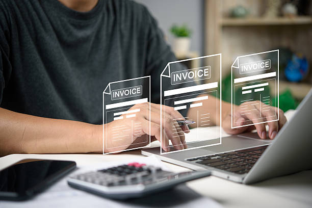 Man working on laptop hands managing electronic invoices with futuristic interface, fintech online payment, accounting software, and financial management automation systems.