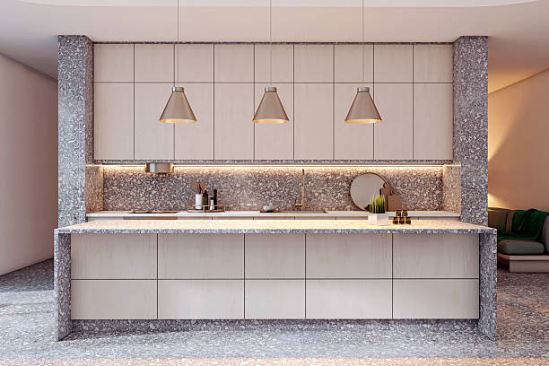 istock Modern stylish kitchen interior with stone counter and cabinets in beige tones, featuring pendant lights and backlit backsplash in cozy home space. 3D Rendering 2220122775