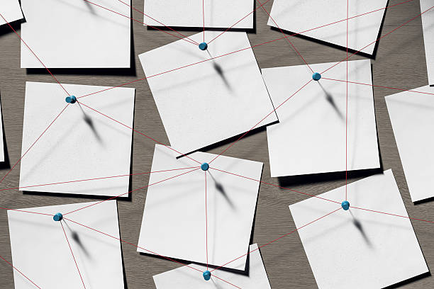 istock Blank note papers pinned with red threads on wooden wall background symbolizing detective investigation or business planning concept. 3D Rendering 2220122844