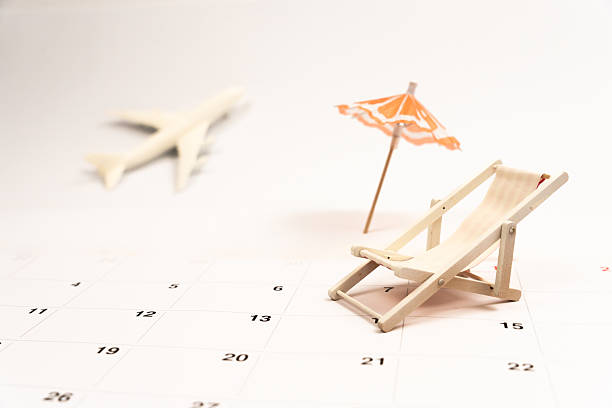 istock Tiny deckchair, miniature airplane perched on calendar, symbolizing summer travel anticipation and wanderlust 2220123002