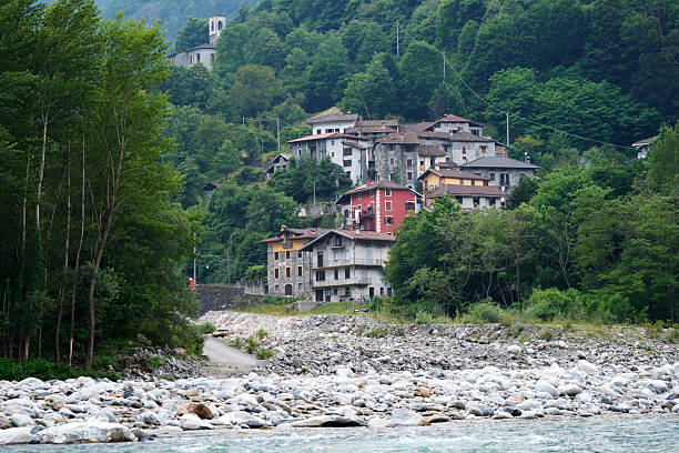torrent. in the background a small mountain village