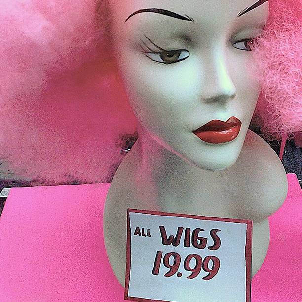 Pink afro hair on Mannequin head.