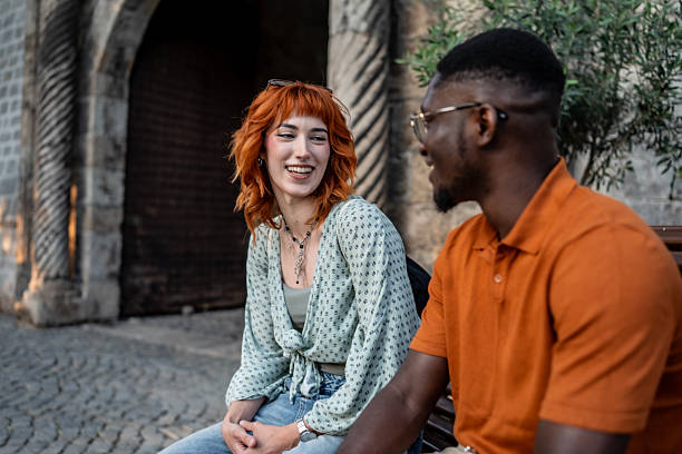 istock Two Friends Smiling Together While Enjoying A Conversation Outdoors 2220134758