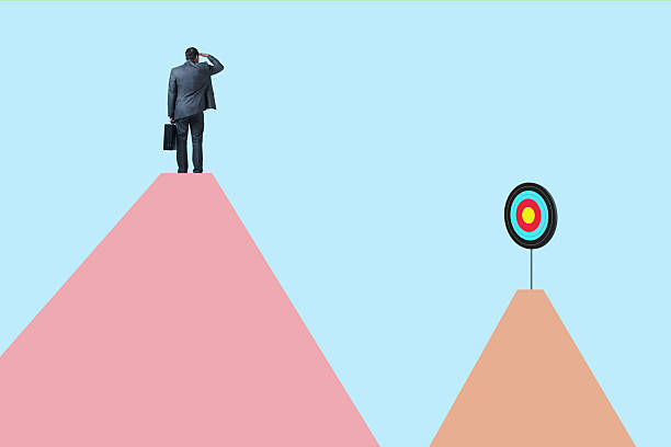 istock Businessman Looking Out Towards Target On Mountain Top 2220138246