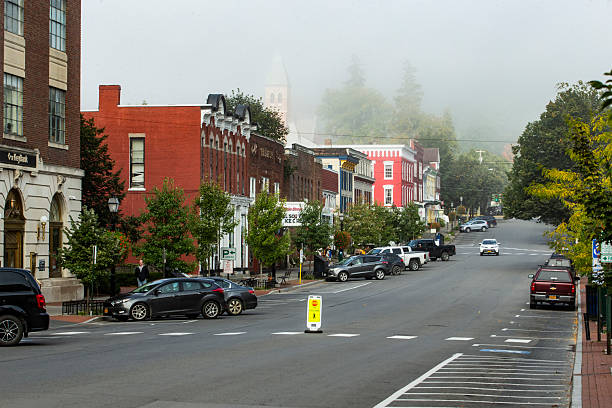 illage of Cooperstown, New York, looking west down Main Street on a foggy morning, fog beginning to lift.  Cooperstown is the home to the National Baseball Hall of Fame and very popular tourist destination, especially during the summer months.  Photo taken September 12, 2017.