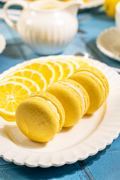 istock Delicious lemon macarons served on a white plate with lemon slices 2220142405
