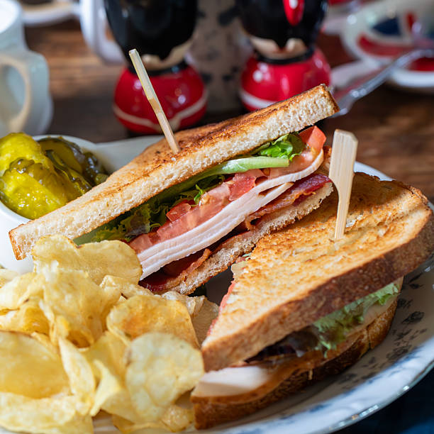 istock Turkey BLT sandwich on toast with crisps and pickles 2220145929