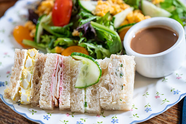 Finger sandwiches with tea and salad