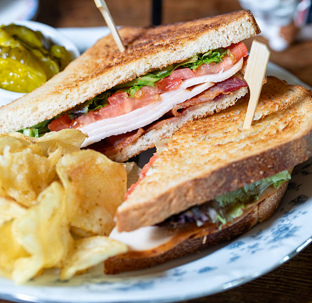 istock Turkey BLT sandwich on toast with crisps and pickles 2220145965