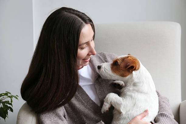 istock Young woman with her wire haired Jack Russell Terrier 2220148165