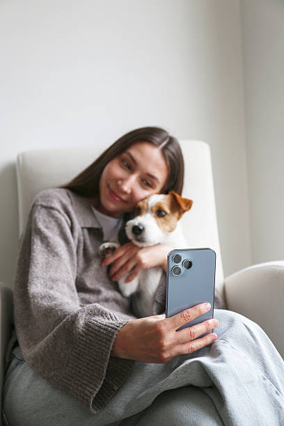 istock Young woman with her wire haired Jack Russell Terrier 2220148255