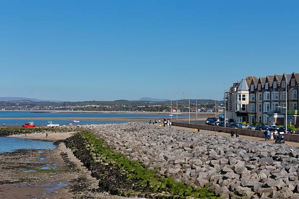 istock A sunny beach scene with a building on the right side. 2220149863
