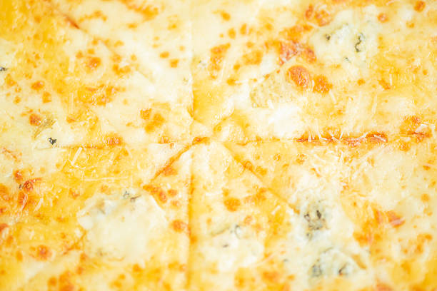 Four cheese pizza as a background macro photo