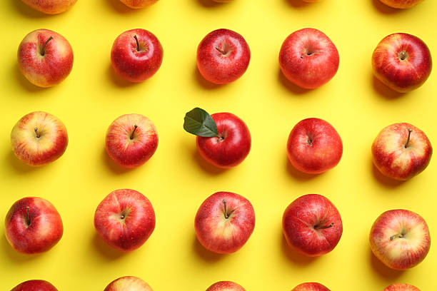 istock Flat lay composition with many red apples on yellow background 2220153245