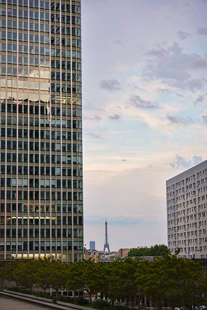 Eiffel Tower seen between buildings in La Defense Paris