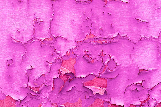 istock Abstract background, peeling paint from a floorboard, texture, wall, concrete, can be used as a background. Fragment of a wall with scratches and cracks, pink texture 2220157556