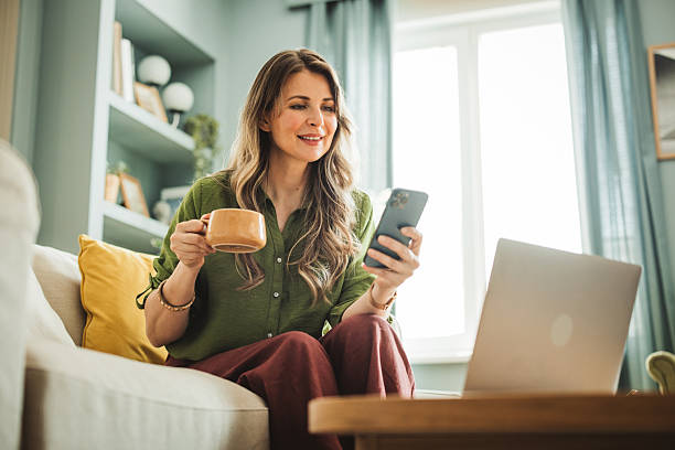 istock Mature woman using laptop at home 2220157923
