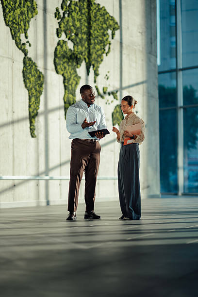 istock Business colleagues discussing global strategy in modern office 2220160466