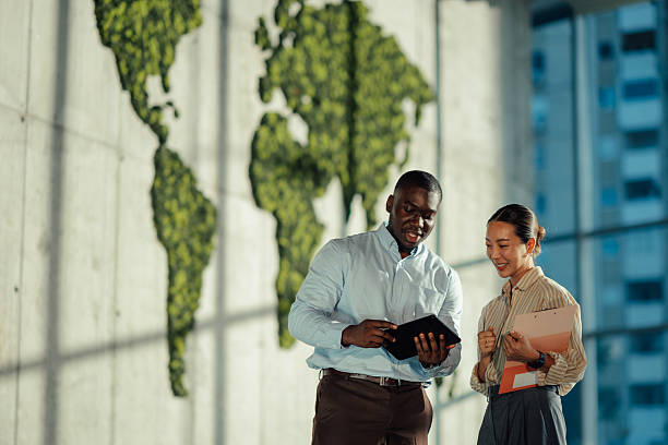 Managers collaborating on sustainable business strategies in modern office