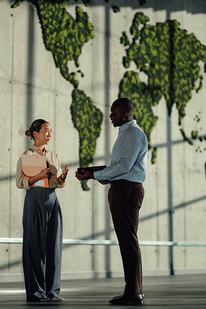 istock Businesspeople discussing global matters in modern office 2220160470