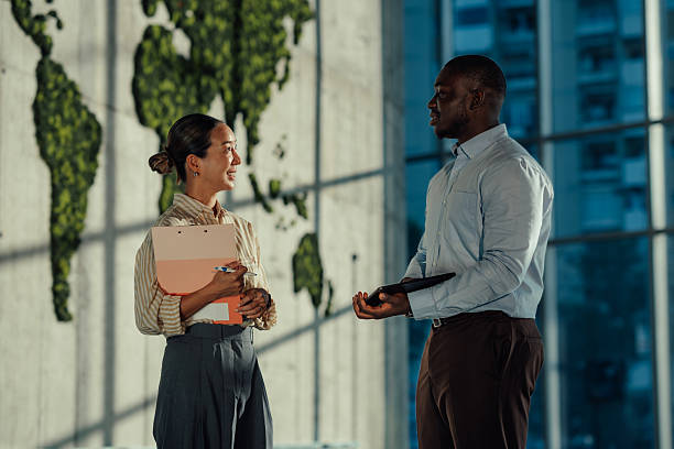 istock Businesspeople discussing global strategy in modern office 2220160476