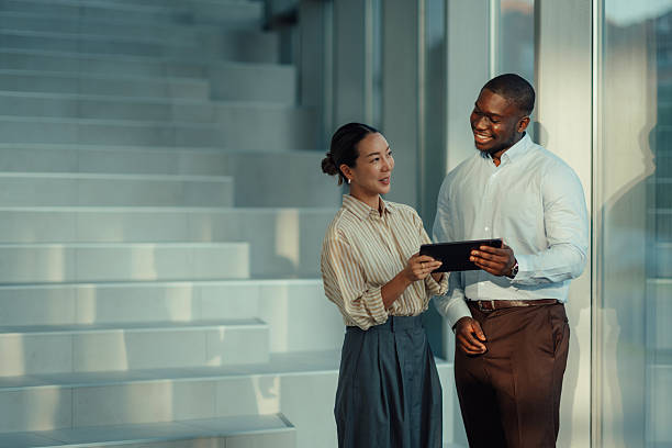 istock Business colleagues using digital tablet in modern office 2220160530