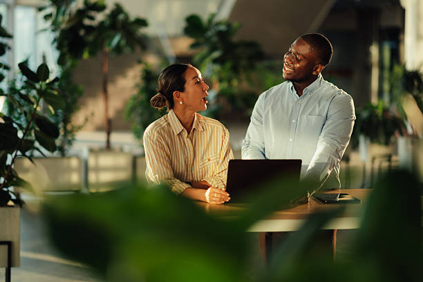 istock Business colleagues collaborating on a laptop in a modern office 2220160596
