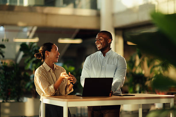 istock Business colleagues collaborating on a project using laptop in modern office 2220160600