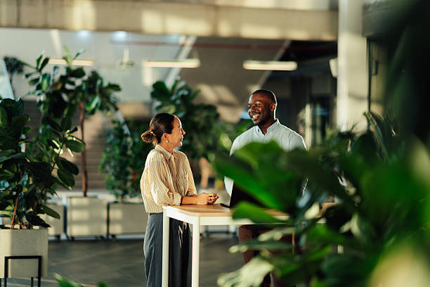 istock Young professionals engaging in collaborative discussion at a modern office 2220160635