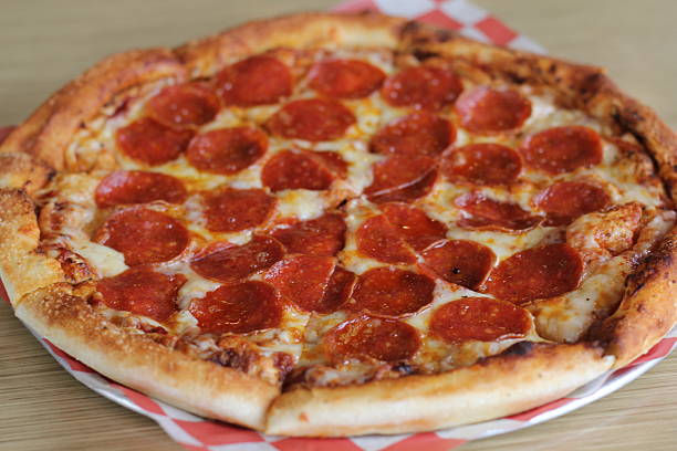 istock A delicious pepperoni pizza with crispy edges featuring a perfectly baked crust and ample cheese 2220160704
