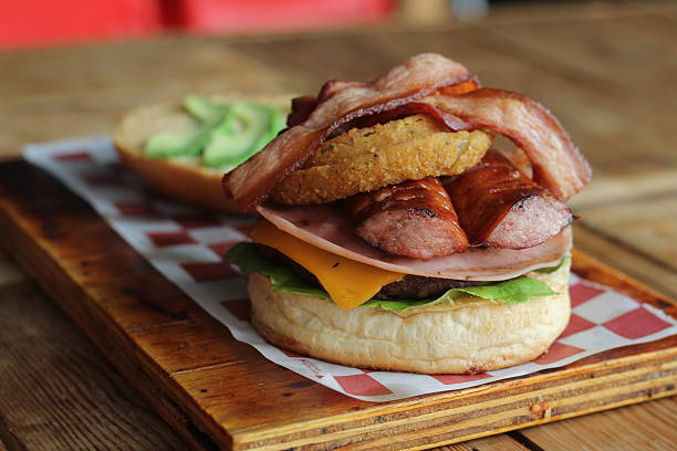 istock A sumptuous gourmet burger stacked high with an array of delicious toppings 2220161013