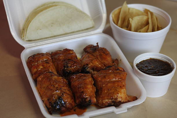 istock This image depicts a takeout box filled with chicken thighs 2220163065