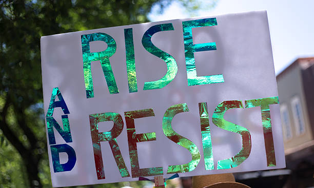 istock Homemade Protest Sign Reading: RISE AND RESIST 2220170424