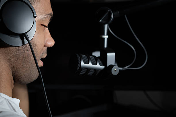 istock Podcast streaming recording at home with microphone and headphone 2220182118