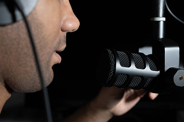 istock Podcast streaming recording at home with microphone and headphone 2220182127