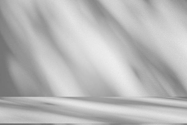 istock Wall interior background, studio and backdrops show products.with shadow from window color white . background for text insertion and presentation product 2220184400