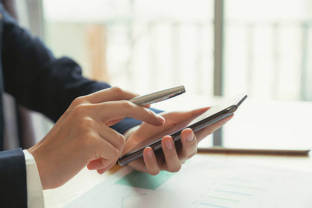istock Businessman hand holding black smartphone and chatting online message on mobile. 2220185108