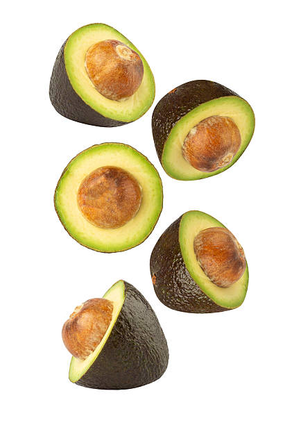 istock Falling Avocado isolated on white background with clipping path, full depth of field 2220186649