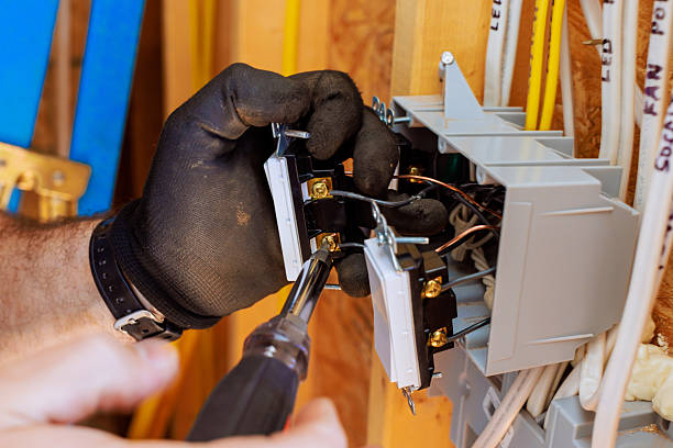 istock Installing electrical switches in a residential setting during a home renovation project 2220188602