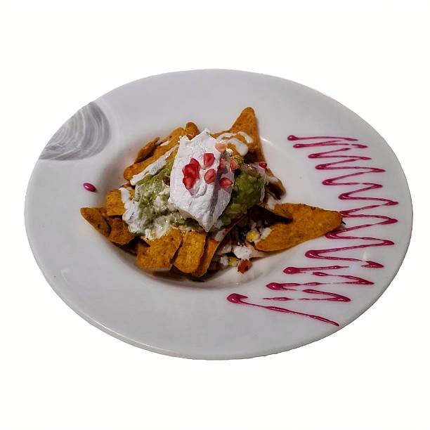 Delicious Mexican nachos with guacamole