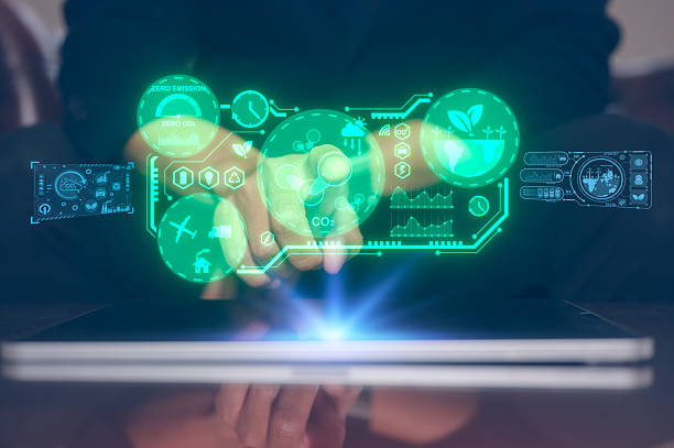 istock Reduce CO2 emissions and carbon footprint to limit global warming and climate change. Sustainable development and green business, man pointing at report and virtual diagram showing co2 emission icon 2220201575