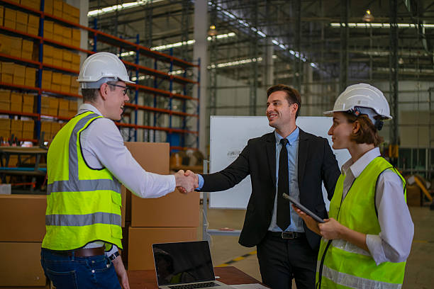 istock Blue collar workers are working and meeting at warehouse. 2220205127