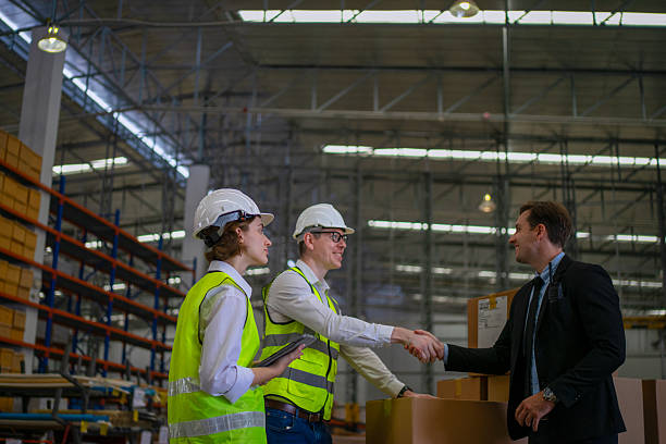 istock Blue collar workers are working and meeting at warehouse. 2220205153