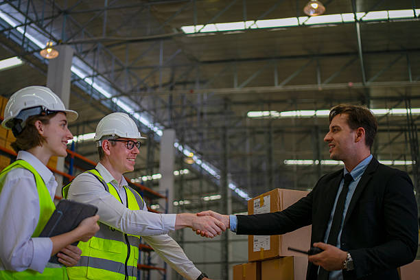 istock Blue collar workers are working and meeting at warehouse. 2220205164